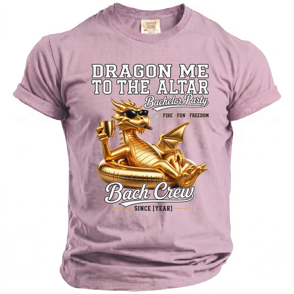 Pink t-shirt with gold dragon graphic and text "Dragon Me To The Altar Bachelor Party Bach Crew".