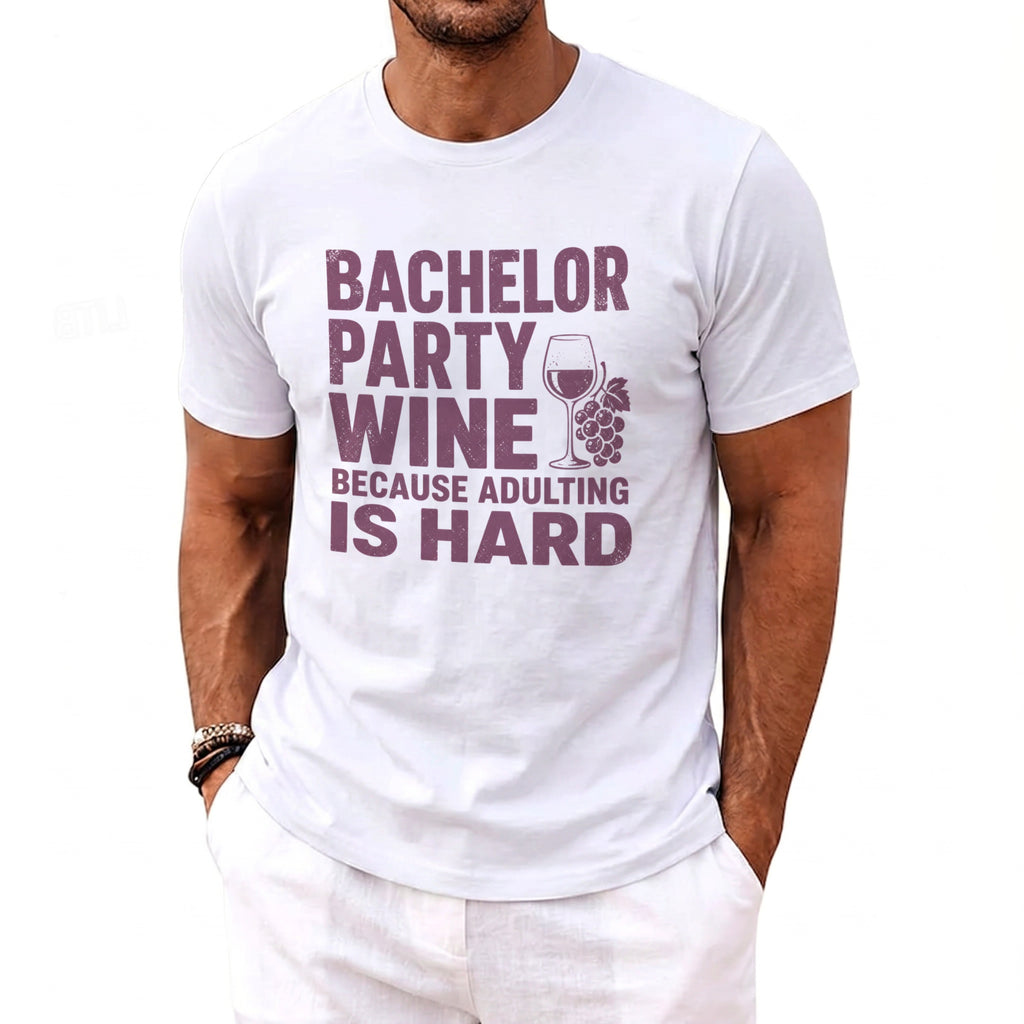 White t-shirt with "Bachelor Party Wine Because Adulting Is Hard" text and wine glass graphic.