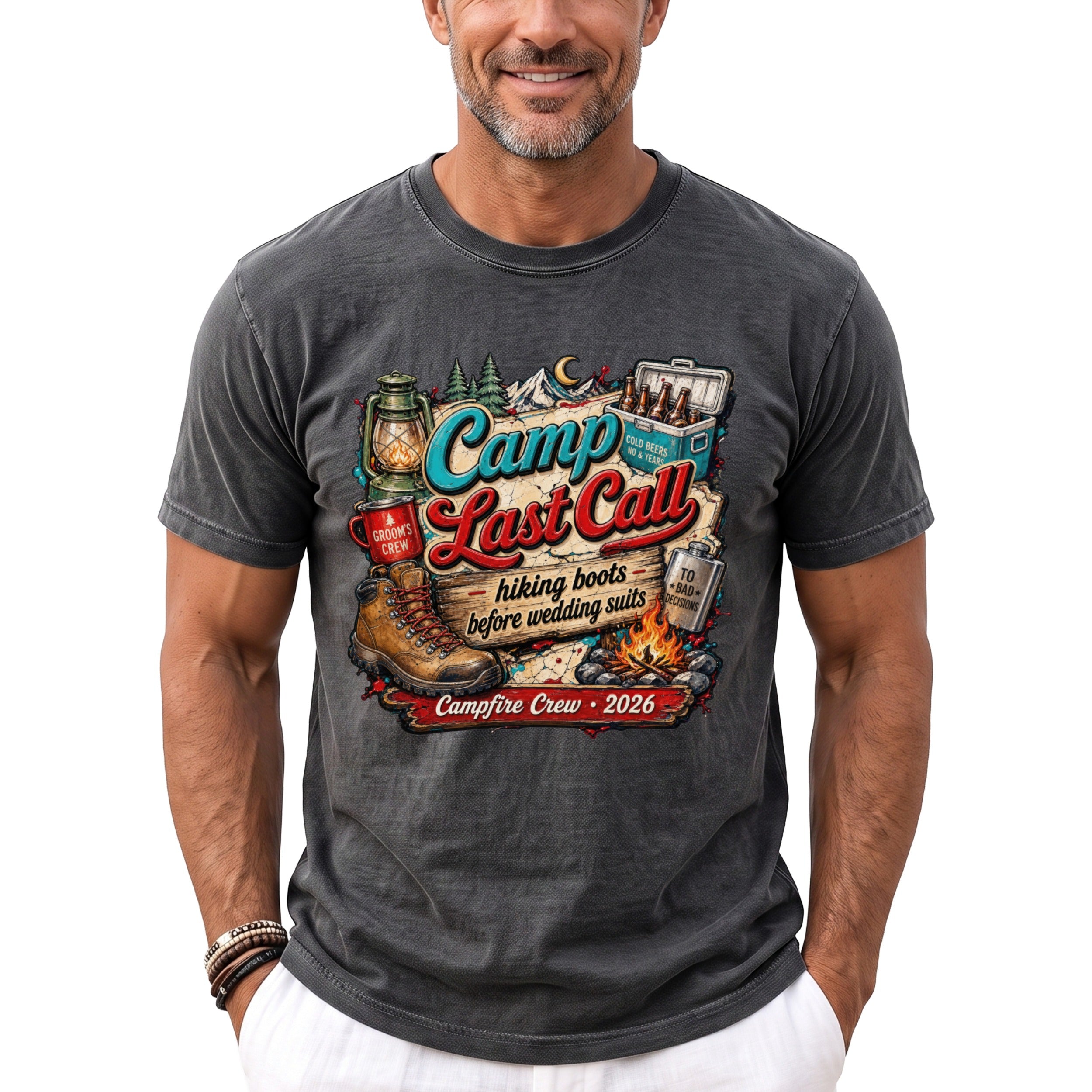 A man wearing a charcoal grey t-shirt featuring a colorful camping-themed graphic and text that reads Camp Last Call.