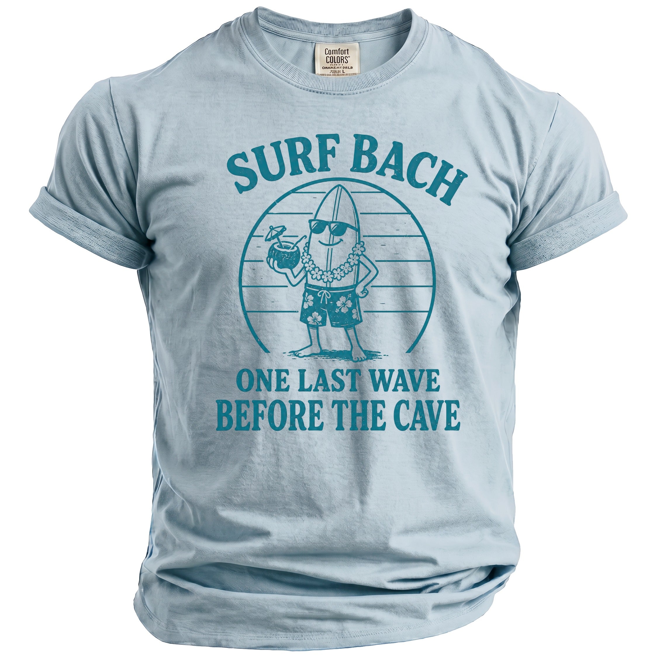 Light blue t-shirt with a graphic of a surfing banana and text "SURF BACH ONE LAST WAVE BEFORE THE CAVE".