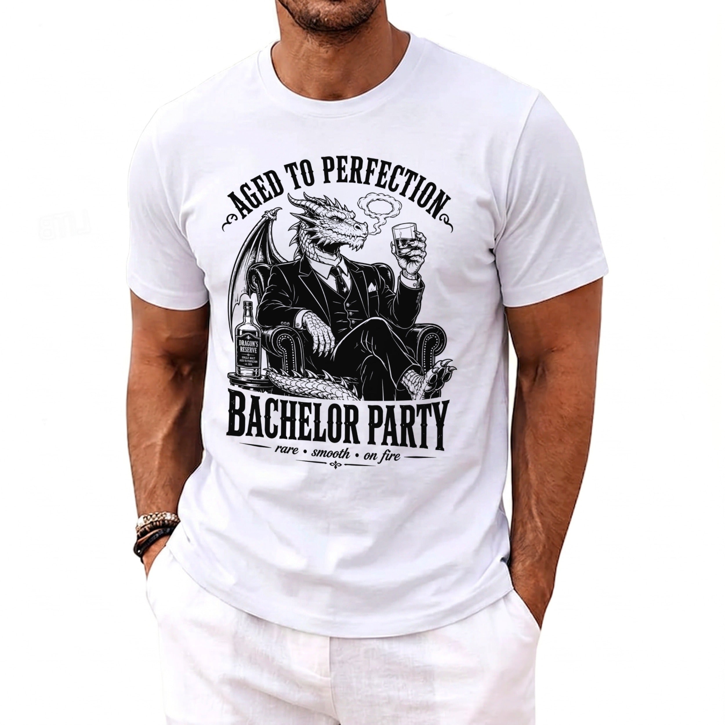 White t-shirt with a dragon labeled "Aged to Perfection" and "Bachelor Party".