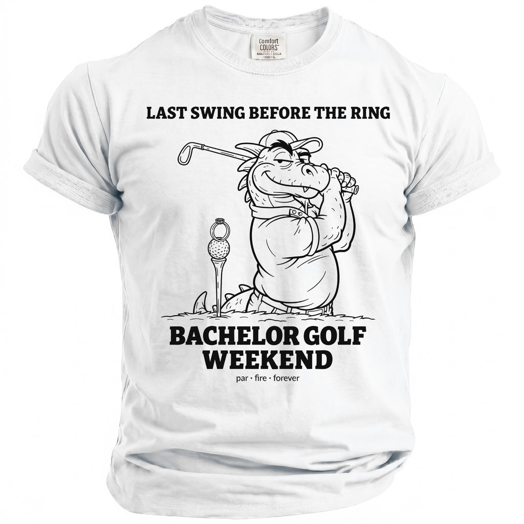White t-shirt with cartoon dragon golfing, text: LAST SWING BEFORE THE RING BACHELOR GOLF WEEKEND.