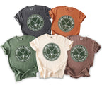 T-shirts in charcoal, terracotta, olive, cream, and brown, each with a golf graphic and text.
