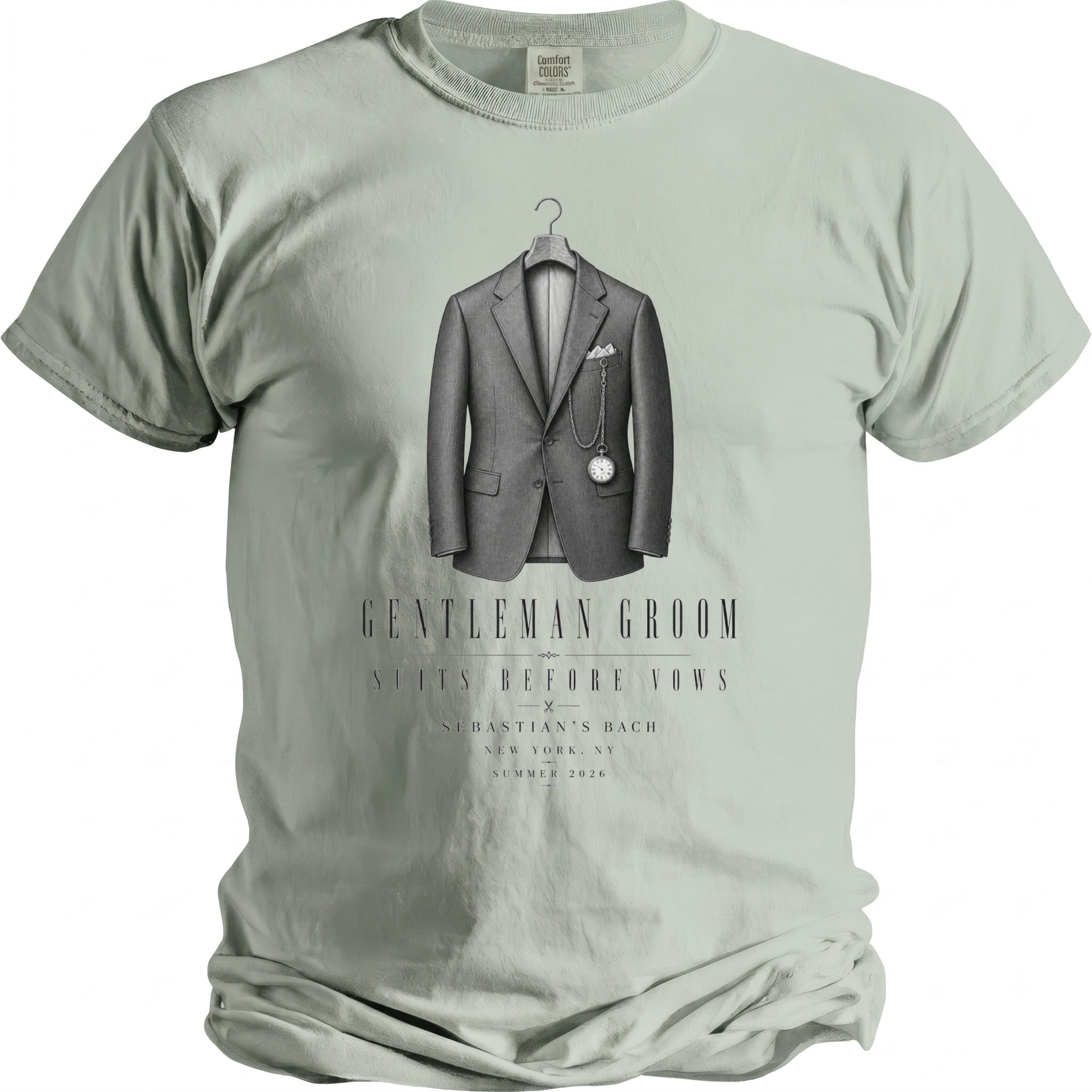 Light green t-shirt with a graphic of a suit, pocket watch, and text "GENTLEMAN GROOM".