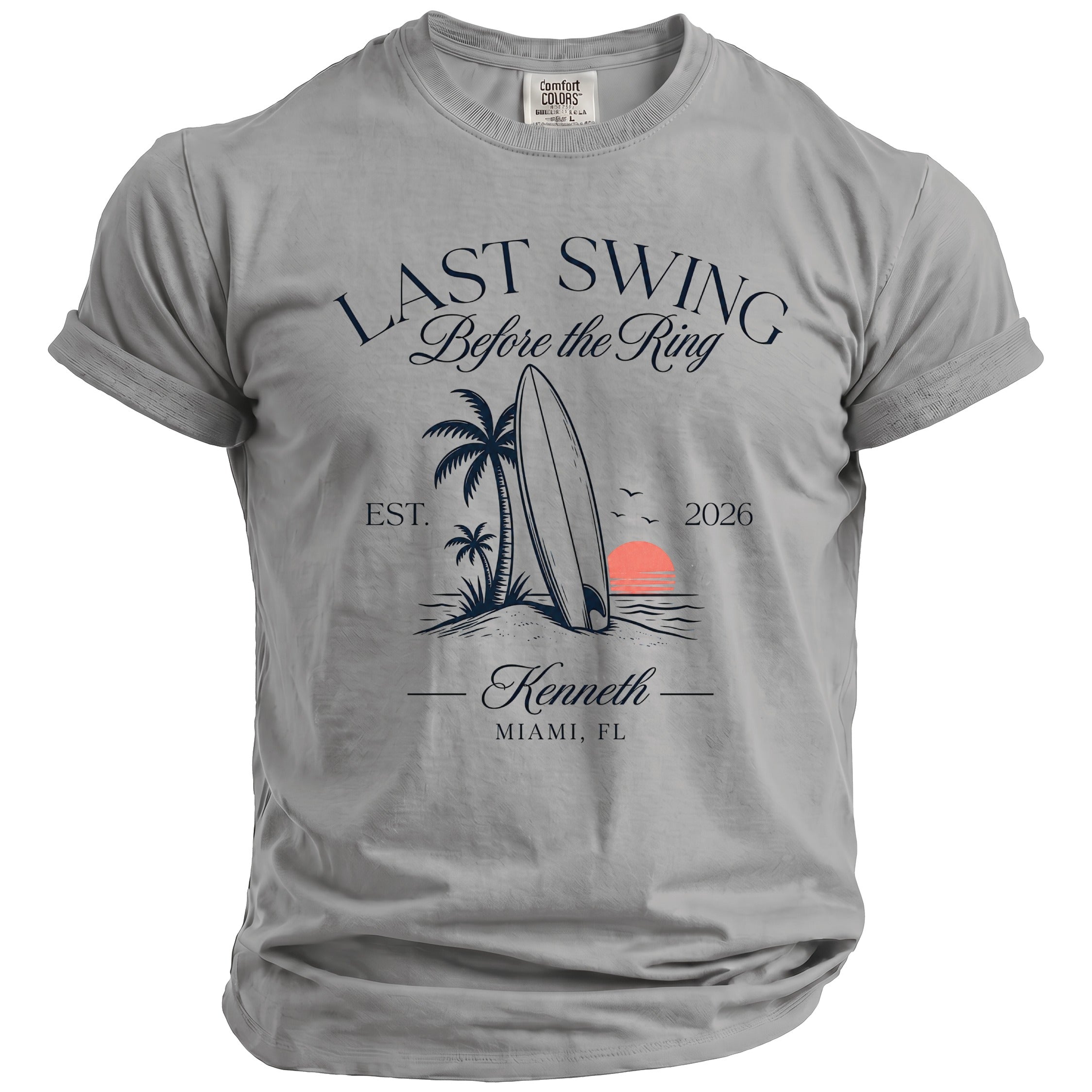 T-shirt graphic with surfboard, palm trees, sunset, and text "Last Swing Before the Ring"
