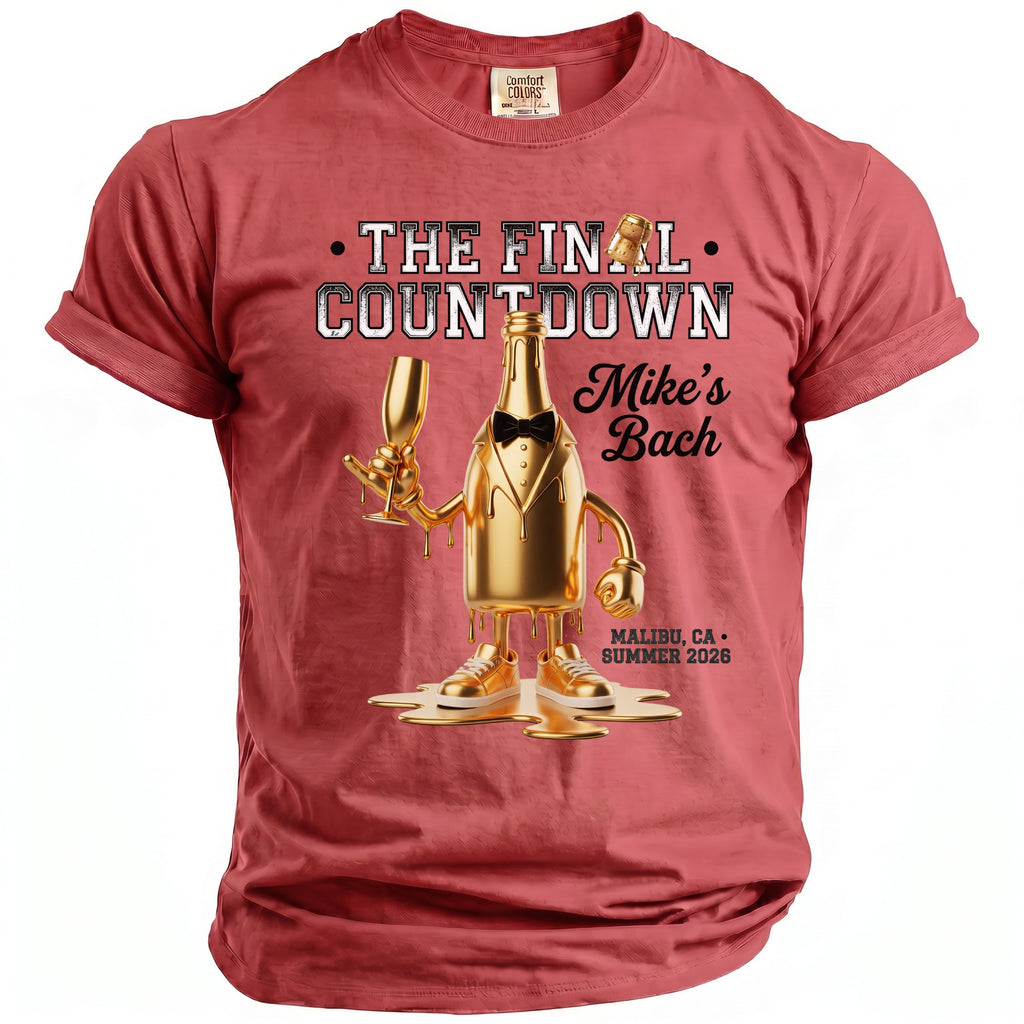 Gold champagne bottle graphic on a red t-shirt, "The Final Countdown Mike's Bach", Malibu, CA Summer 2026.