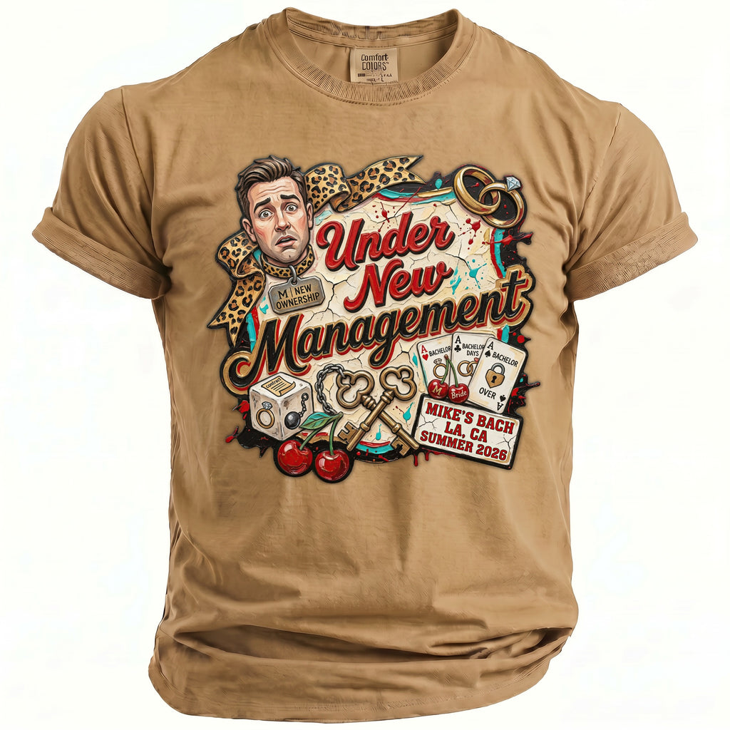 T-shirt with "Under New Management" graphic featuring surprised man, keys, and wedding rings.