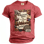 Red t-shirt with a graphic of a dragon, skull, D20 die, potions, and text "Kenneth's Bach The Fellowship The Wildcard of the Groom Edinburgh, Scotland Summer 2026".