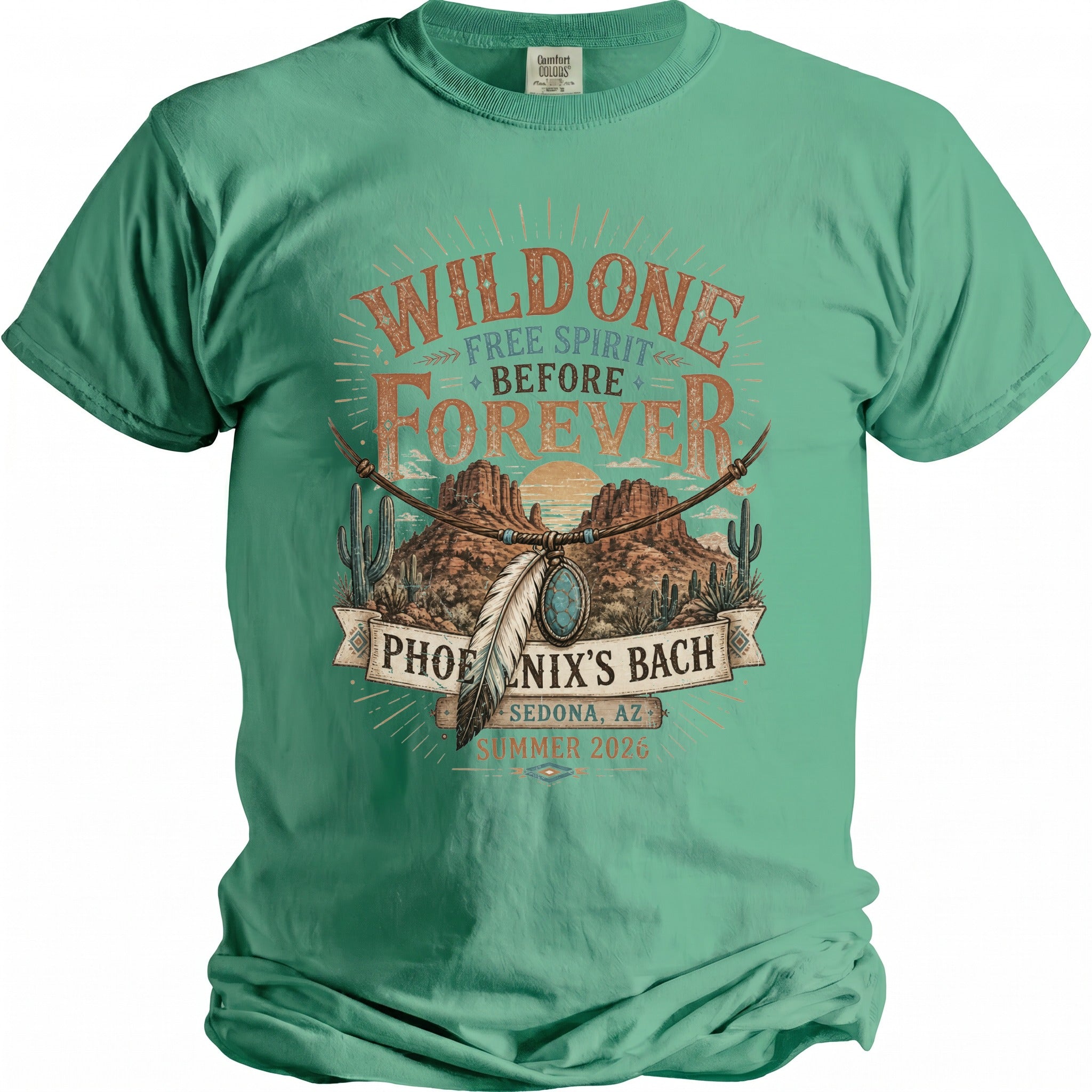 T-shirt with desert landscape, cacti, and text "Wild One Free Spirit Before Forever Phoenix's Bach Sedona, AZ Summer 2026".