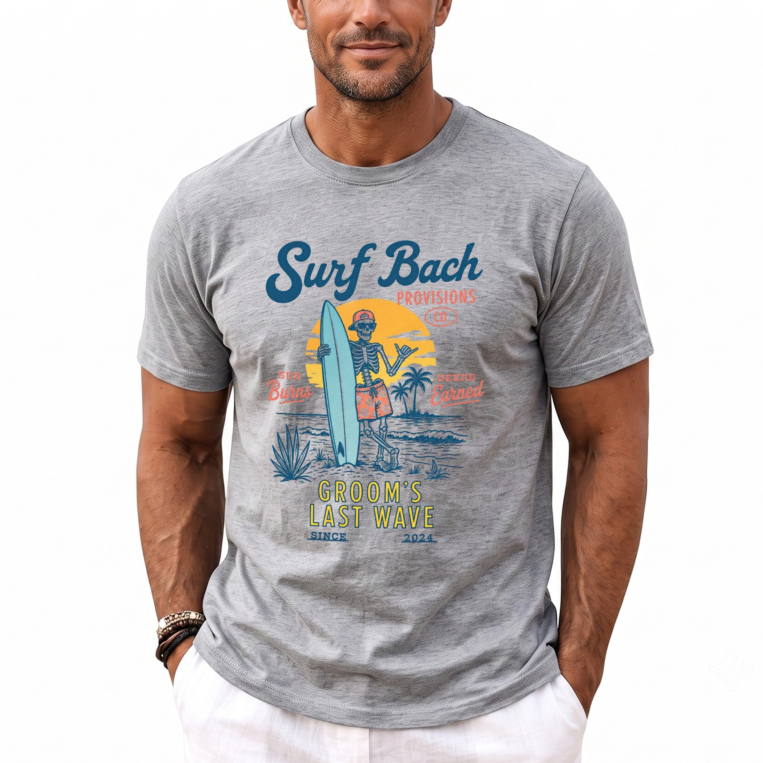 Gray t-shirt with skeleton surfer graphic: "Surf Bach", "Groom's Last Wave", "Since 2024".