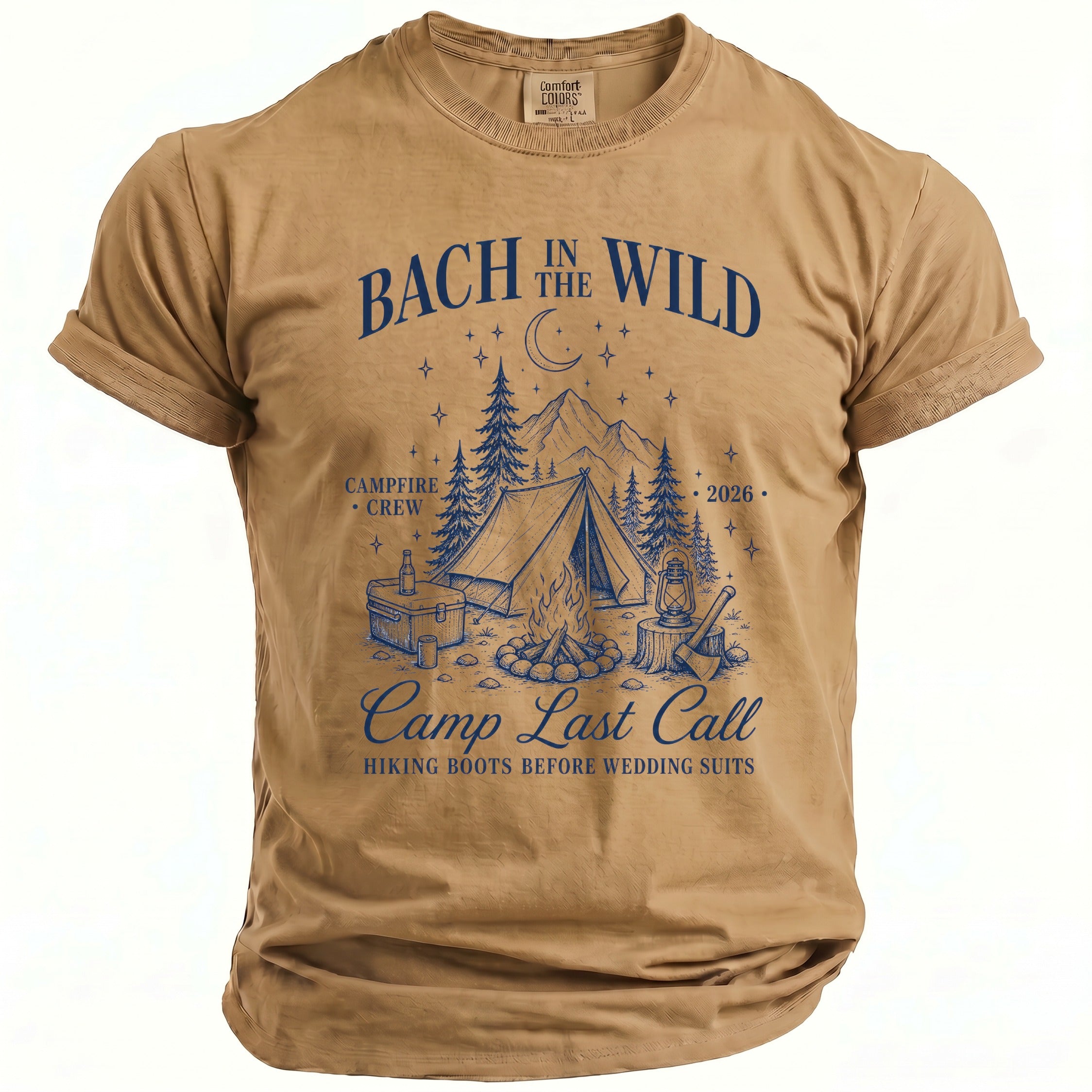 Tan t-shirt with blue text and camping graphic: "Bach in the Wild," "Campfire Crew," "Camp Last Call."