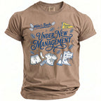 T-shirt with blue text "Mike's Bach Under New Management" and graphics.