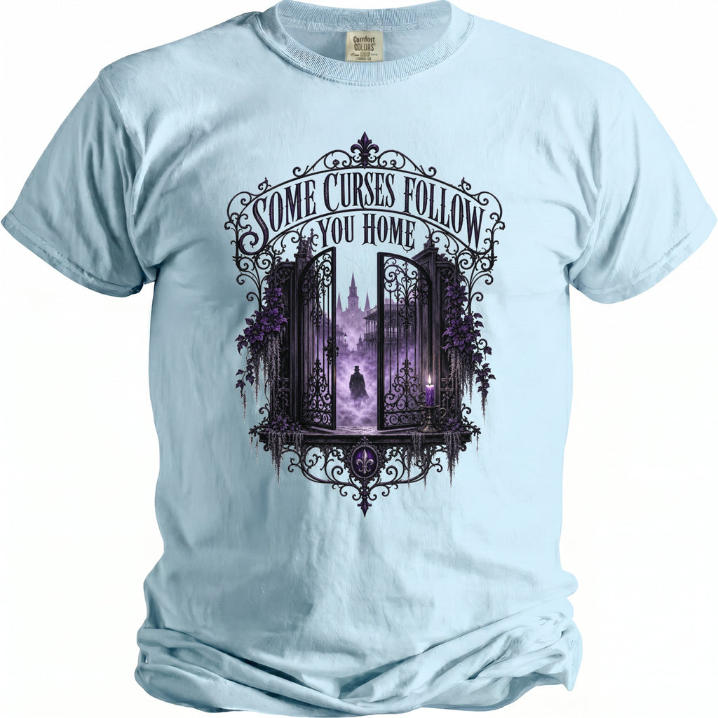 Light blue t-shirt with gothic gate design and text "Some Curses Follow You Home".