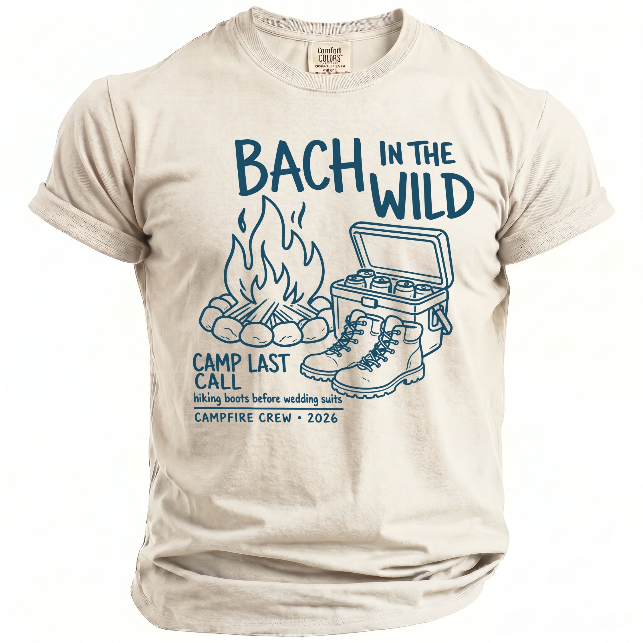 Cream t-shirt with "Bach in the Wild" graphic, campfire, cooler, and boots.