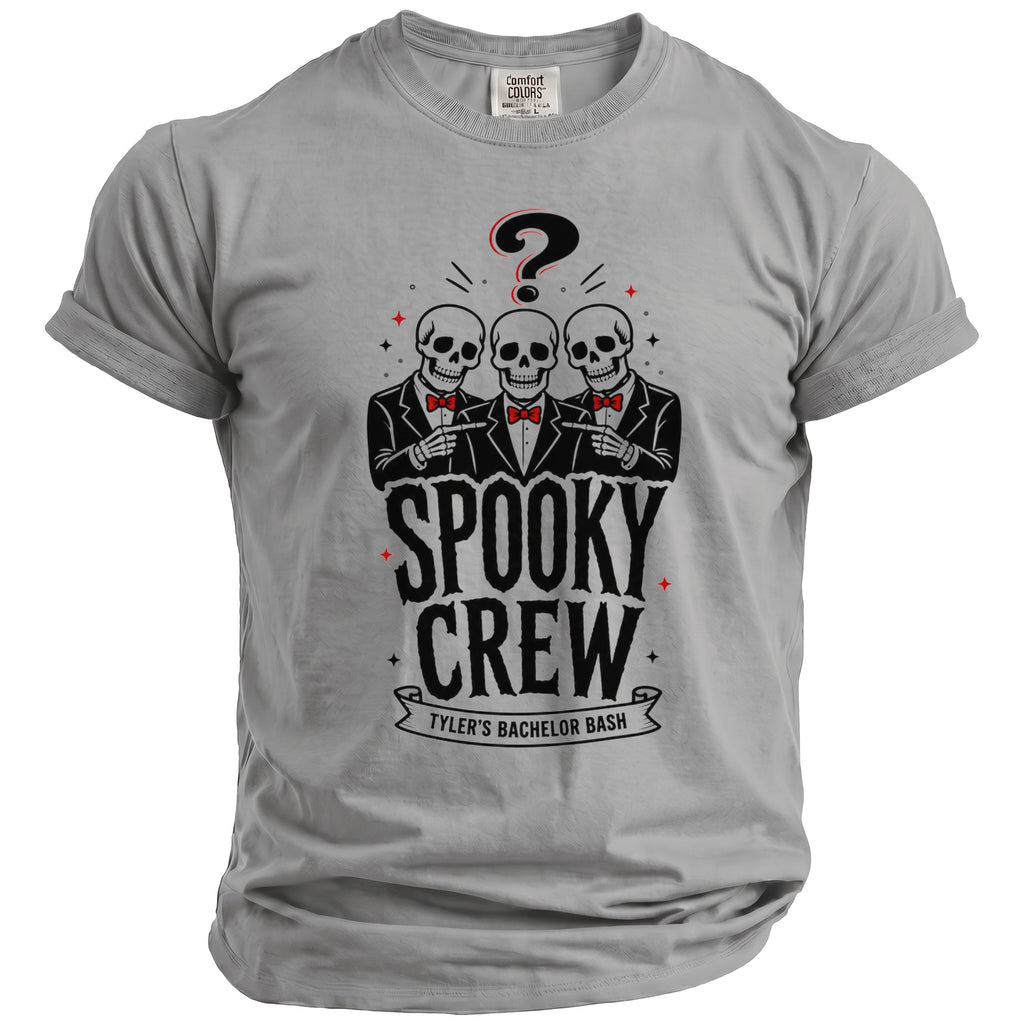 Grey t-shirt with graphic of three skeletons pointing, "Spooky Crew," and "Tyler's Bachelor Bash."