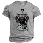 Grey t-shirt with graphic of three skeletons pointing, "Spooky Crew," and "Tyler's Bachelor Bash."