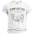 White t-shirt with "Camp Last Call" design featuring campfire, signs, and camping chair.
