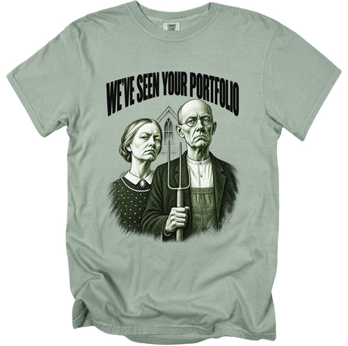T-shirt with "WE'VE SEEN YOUR PORTFOLIO" text and a drawing of a stern couple.