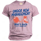 T-shirt with "Under New Management Mike's Bach LA, CA Summer 2026" text and graphic.