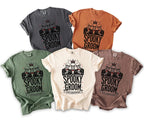 T-shirts featuring three skeletons in suits with the text "Spooky Groom Tyler's Bachelor Bash."
