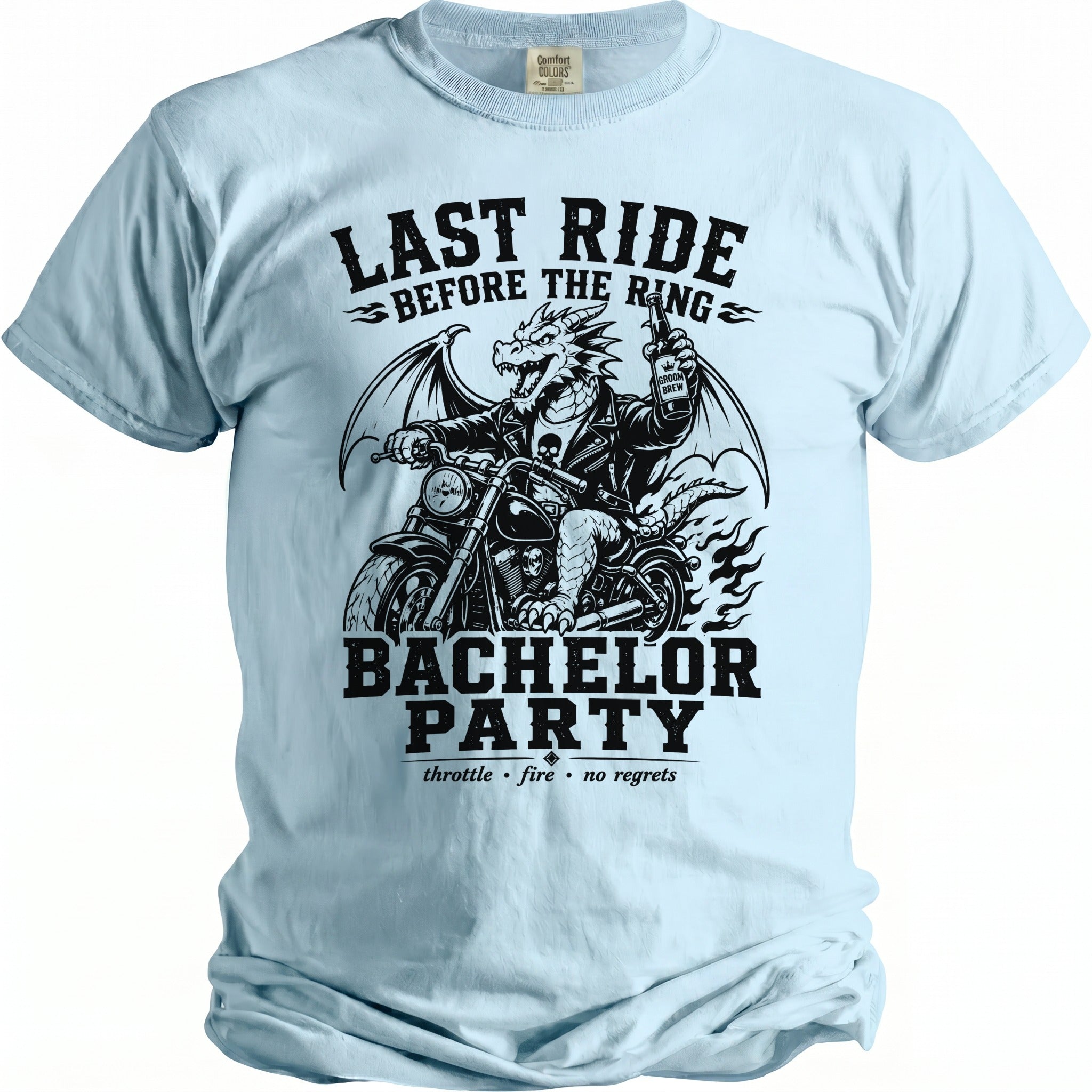 Light blue t-shirt with a black graphic of a dragon on a motorcycle holding a beer, titled "Last Ride Before The Ring" and "Bachelor Party".