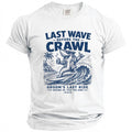White t-shirt with blue graphic: shark surfing, holding drink, text "Last Wave Before The Crawl Groom's Last Ride".