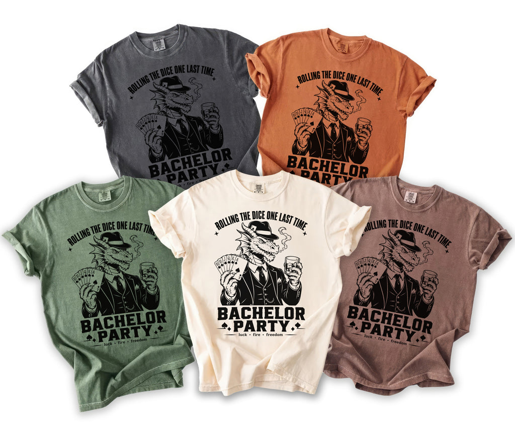 Several t-shirts with a dragon graphic and text "Bachelor Party" and "Rolling the Dice".