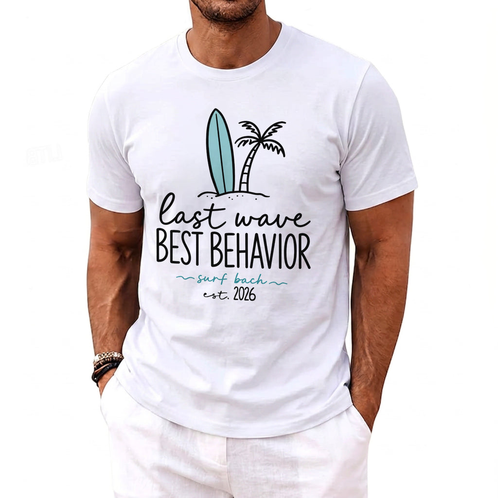 White t-shirt with "last wave best behavior surf bach est. 2026" graphic.