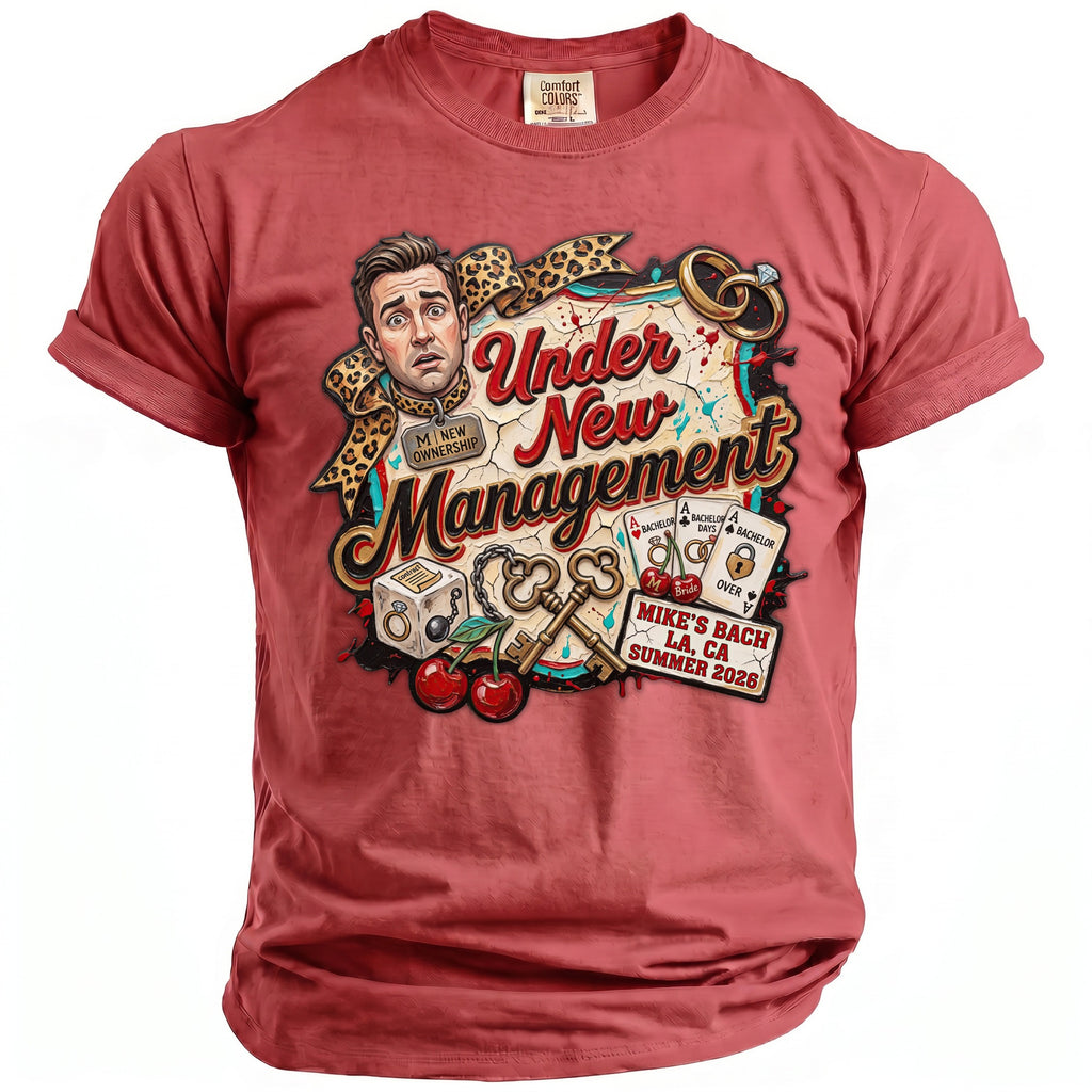 Shirt graphic: man with worried expression, "Under New Management," keys, rings, and "Mike's Bach" text.