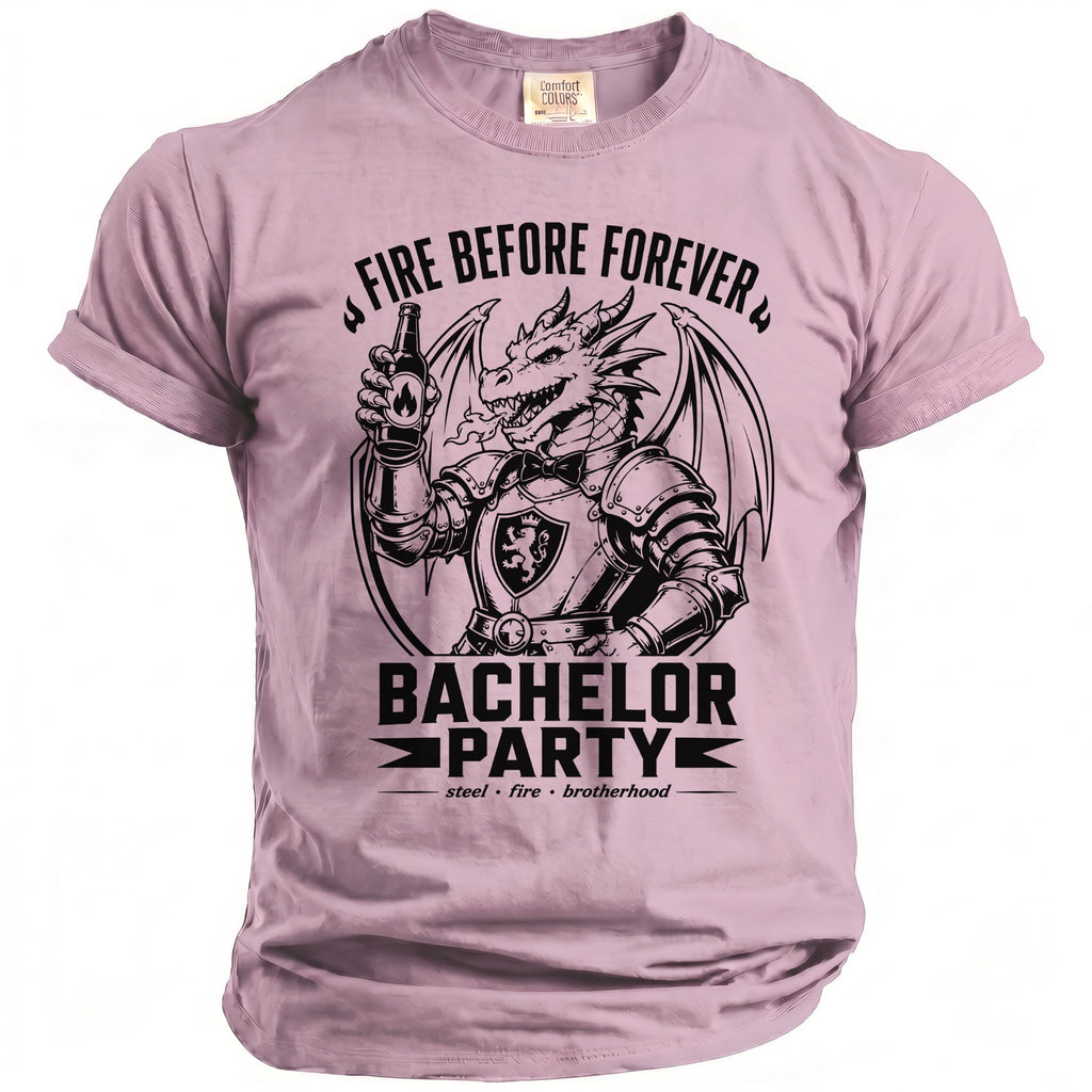 Pink t-shirt with black graphic of a dragon in armor holding a beer bottle, text reads "FIRE BEFORE FOREVER BACHELOR PARTY".