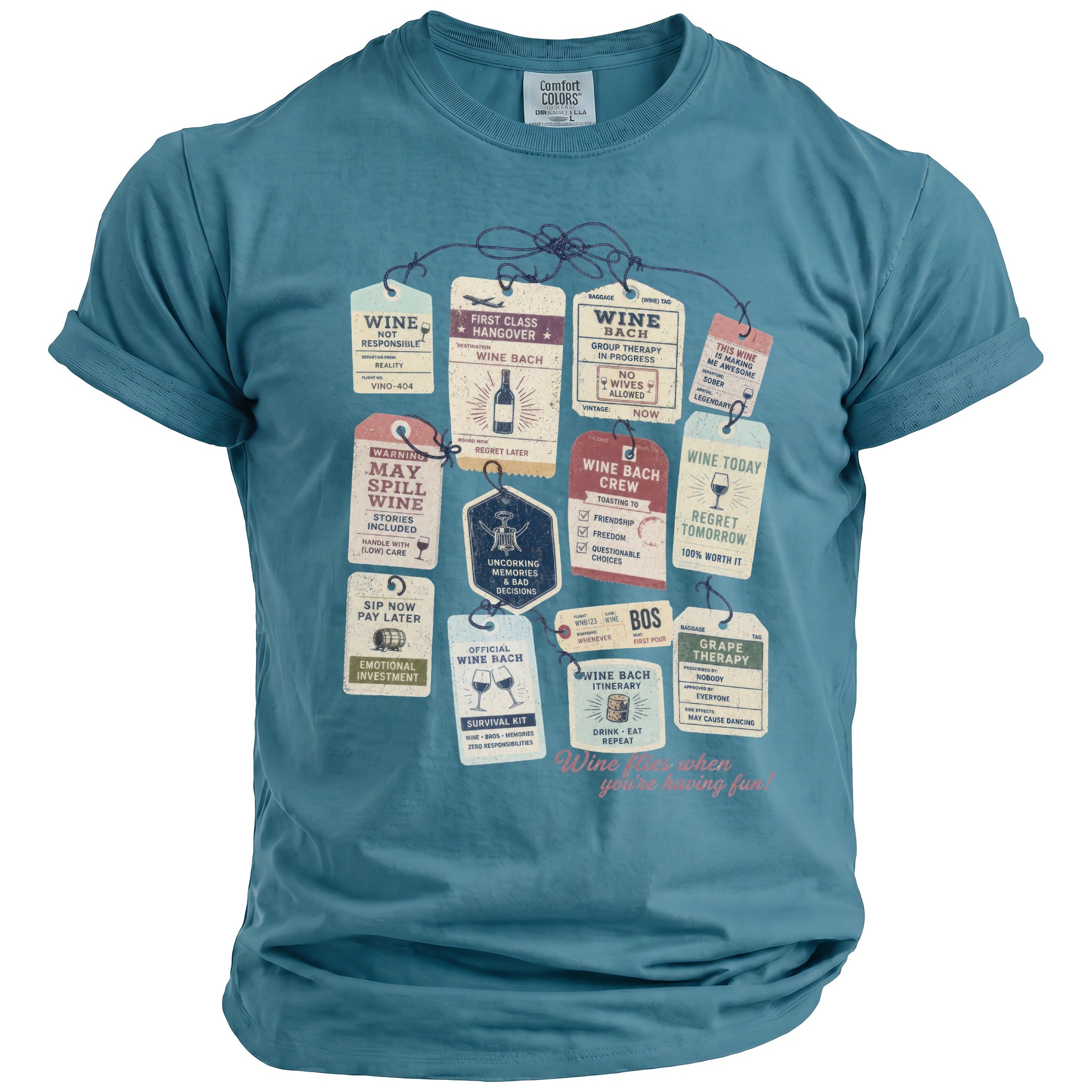 Teal t-shirt featuring a graphic of various vintage-style luggage tags with wine-themed text.