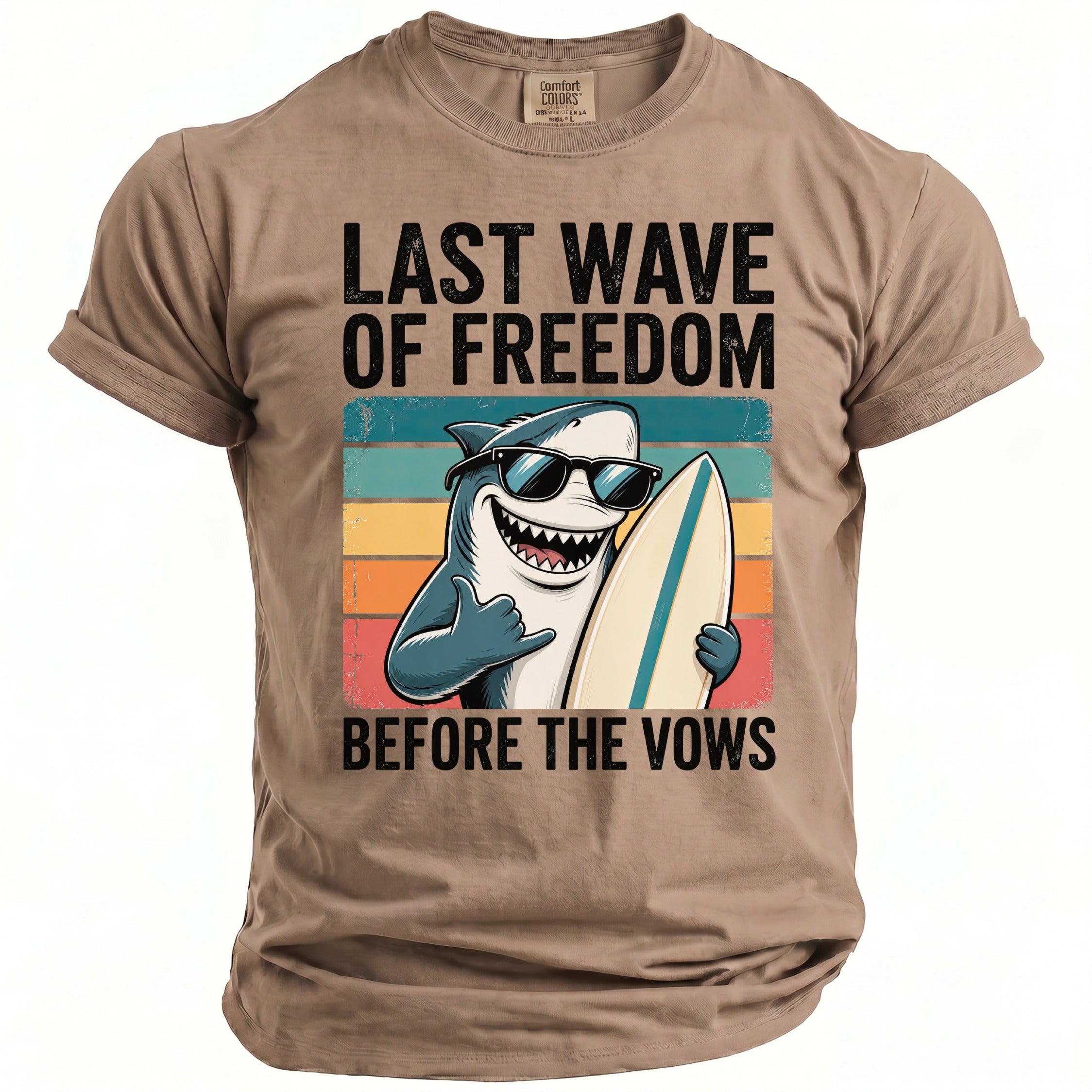 T-shirt with cartoon shark in sunglasses holding surfboard and text "LAST WAVE OF FREEDOM BEFORE THE VOWS".