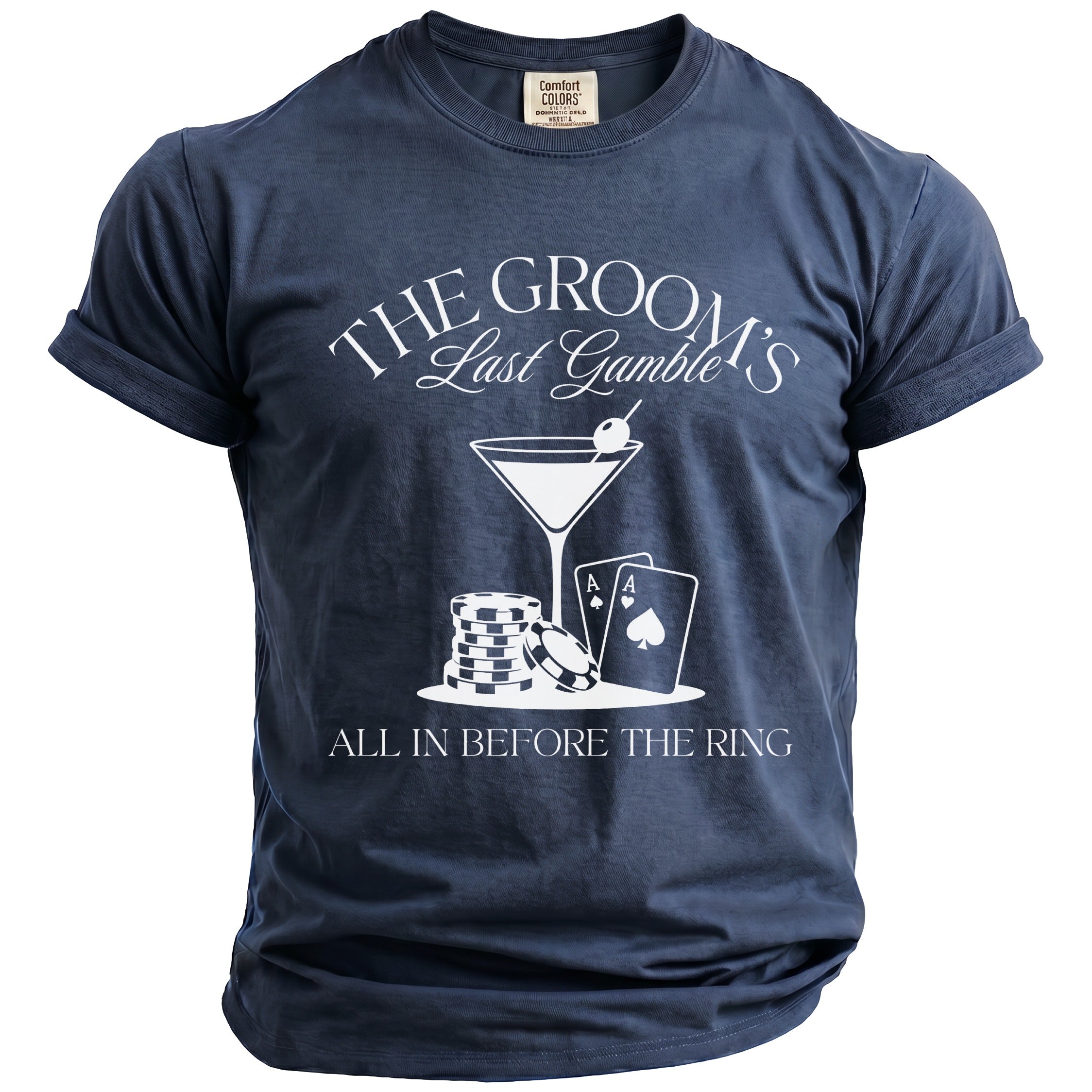 Dark blue t-shirt with white text and graphics: "The Groom's Last Gamble", cocktail, chips, aces, "All in Before the Ring".