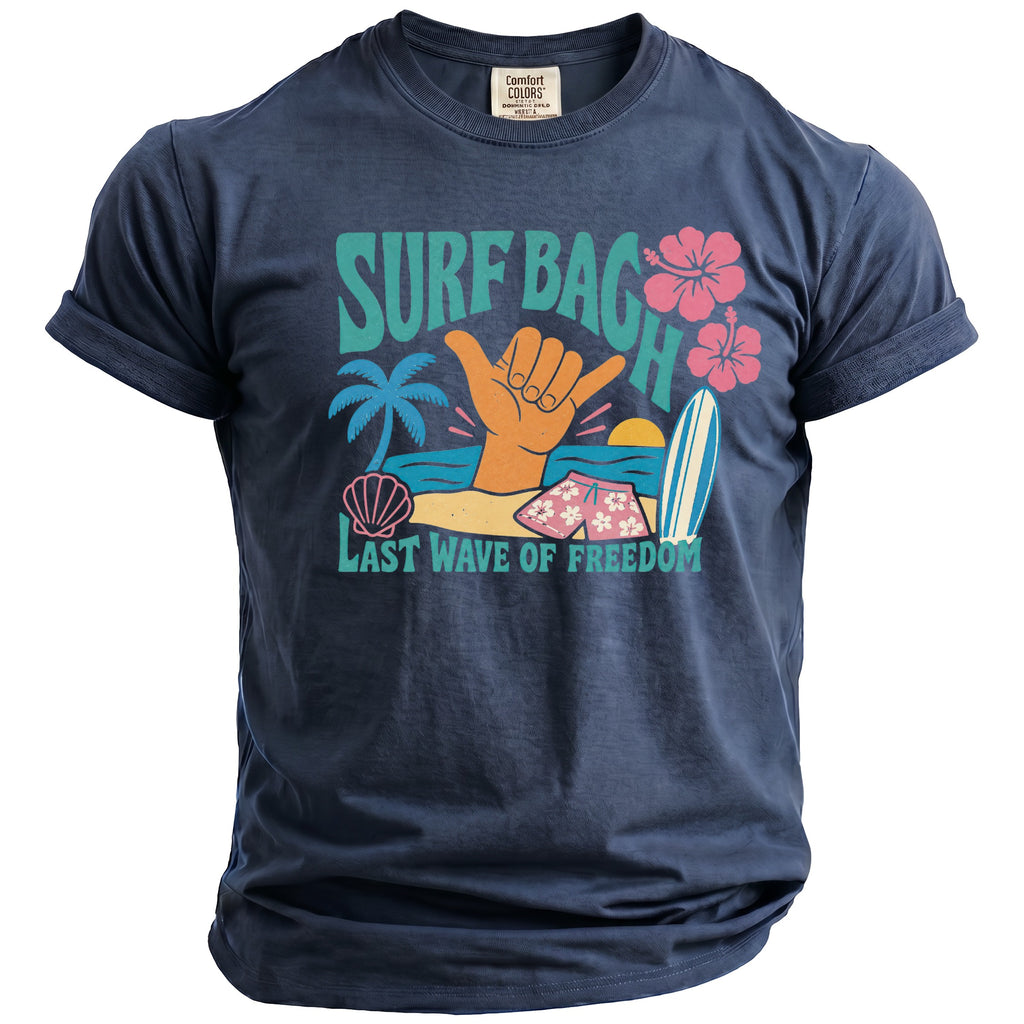 Navy blue t-shirt with "Surf Bach" and "Last Wave of Freedom" text and beach graphics.