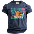 Navy blue t-shirt with "Surf Bach" and "Last Wave of Freedom" text and beach graphics.