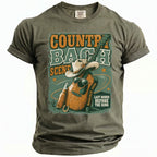 Olive t-shirt with "Country Bach Scene Nashville 2026 Last Rodeo Before The Ring" graphic.