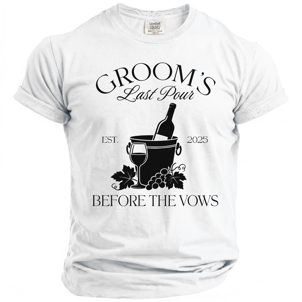 White t-shirt with black text reading "GROOM'S Last Pour EST. 2025 BEFORE THE VOWS".