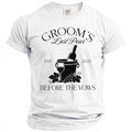 White t-shirt with black text reading "GROOM'S Last Pour EST. 2025 BEFORE THE VOWS".