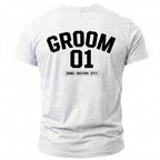 White t-shirt with "GROOM 01" and "[NAME] - BACH 2026 - [CITY]".