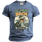Blue t-shirt with "Alpine Bach Bavaria 2026 Summit Before the Commitment" graphic.