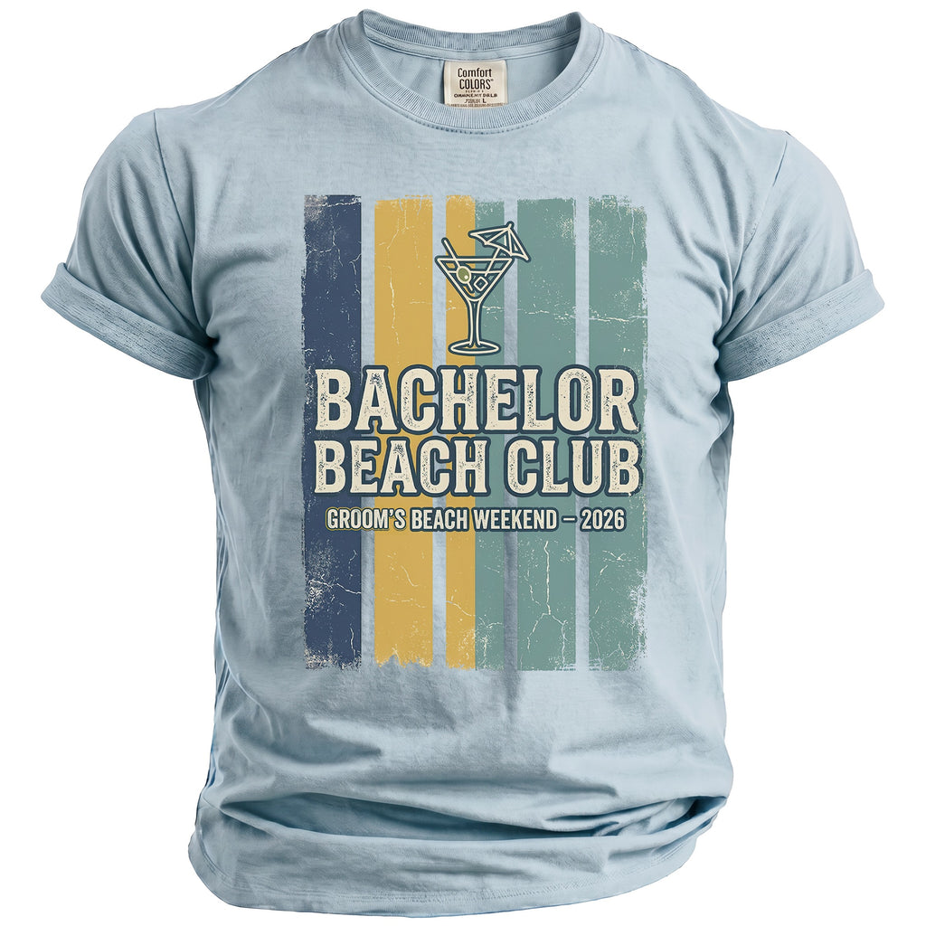 Light blue t-shirt with "Bachelor Beach Club Groom's Beach Weekend - 2026" graphic.