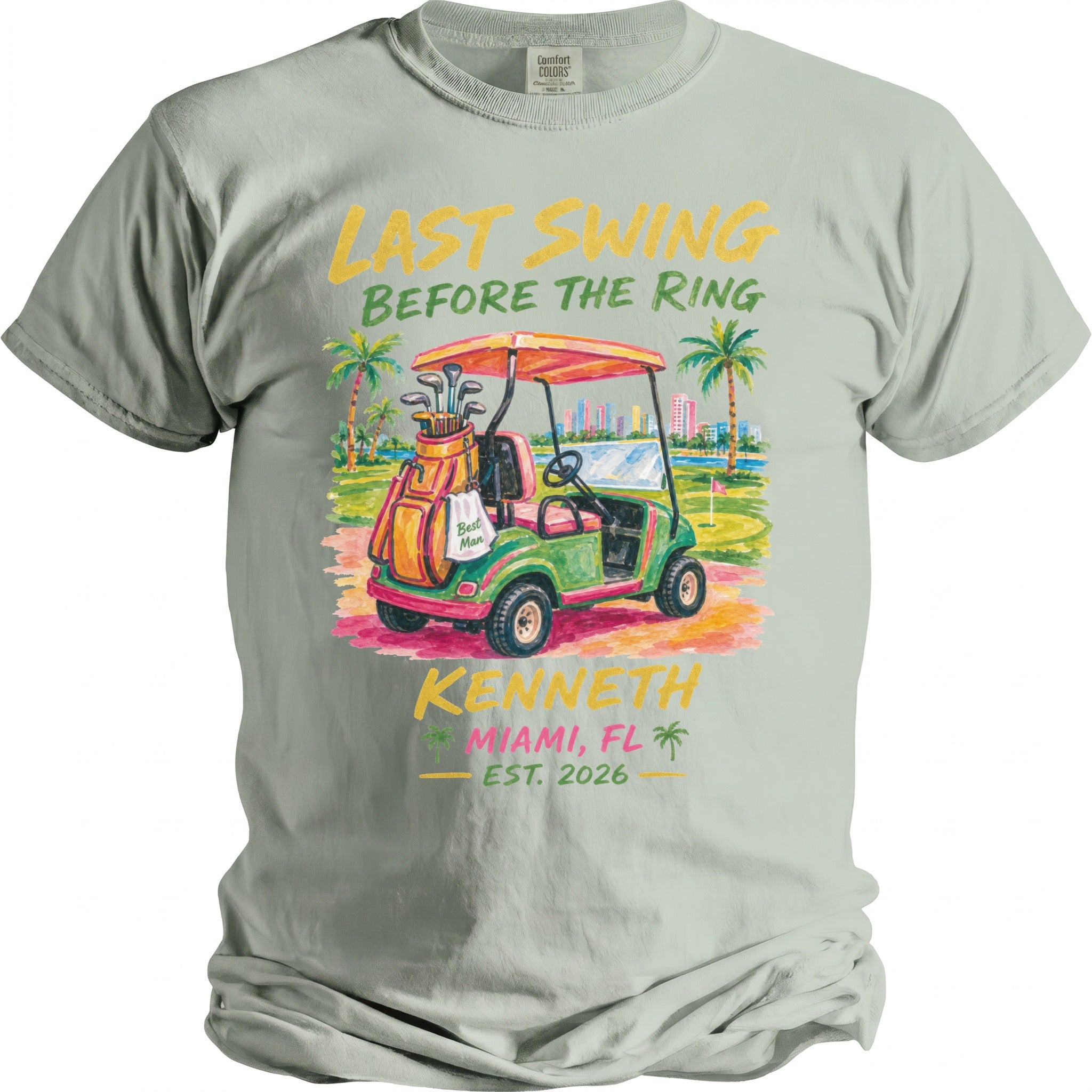 T-shirt graphic: "Last Swing Before The Ring" with golf cart, palms, city, and "Kenneth Miami, FL Est. 2026".