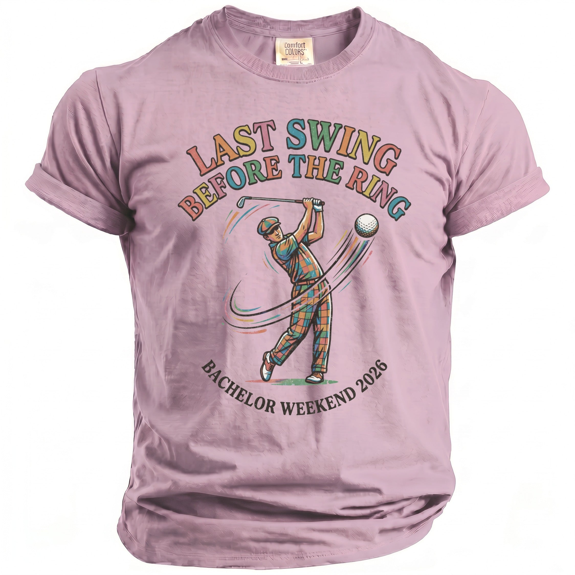 Lavender t-shirt with graphic of golfer and text "LAST SWING BEFORE THE RING BACHELOR WEEKEND 2026".