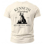 Light cream t-shirt with black "KENNETH Last Swing EST. 2026 BeFor The Ring Miami, FL" golf graphic.