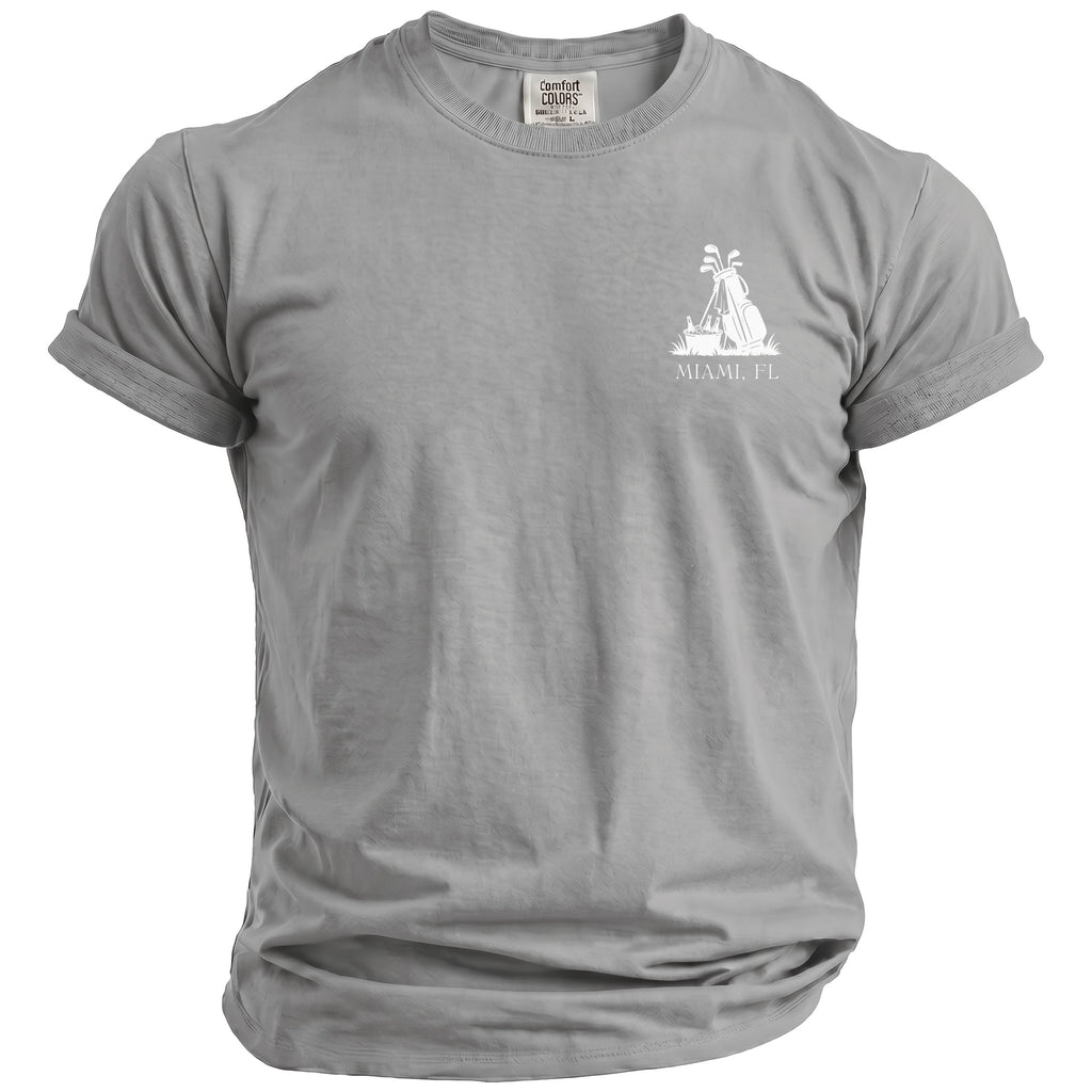 Grey t-shirt with white graphic of golf bag, clubs, and text "MIAMI, FL".