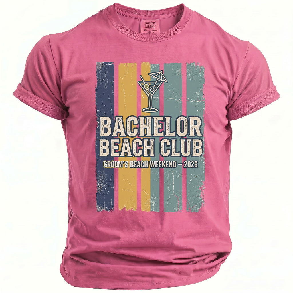 Pink t-shirt with "Bachelor Beach Club Groom's Beach Weekend 2026" graphic.