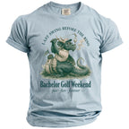 Light blue t-shirt with dragon golfer graphic and text "Bachelor Golf Weekend".