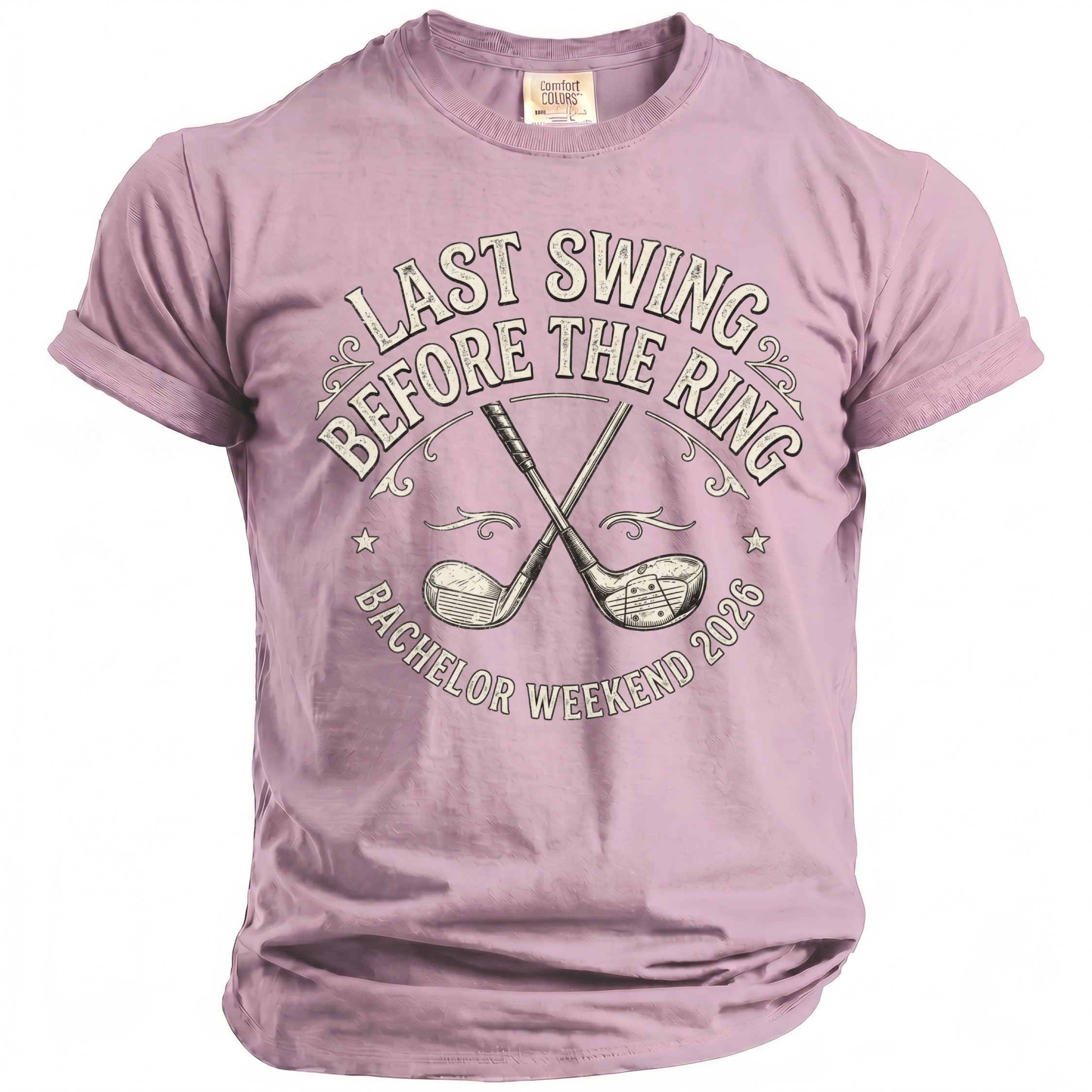 Purple t-shirt with crossed golf clubs and text: "LAST SWING BEFORE THE RING BACHELOR WEEKEND 2026".