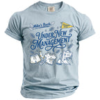Light blue t-shirt with "Mike's Bach Under New Management Summer 2026" graphic.