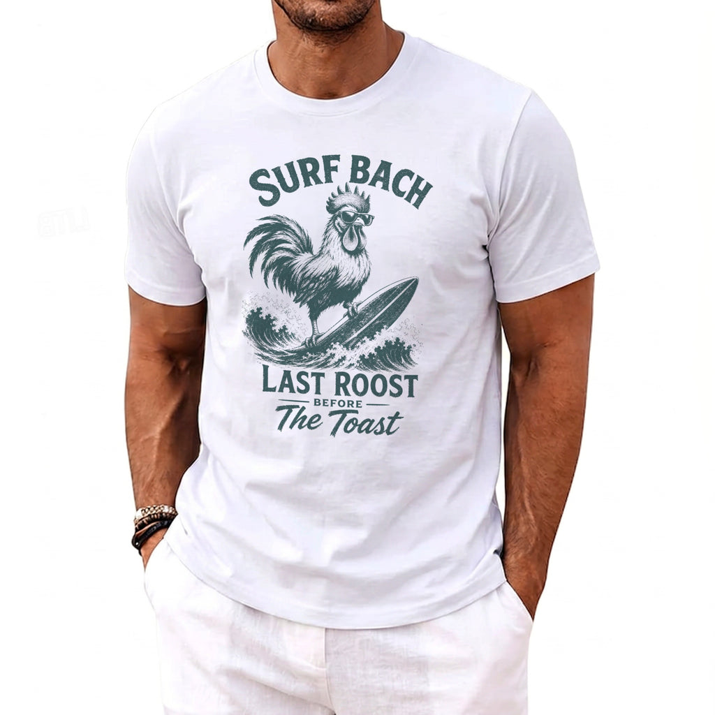 White t-shirt with "Surf Bach Last Roost Before The Toast" text and a rooster surfing.